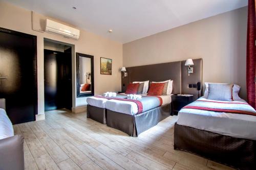 Habitación Quíntuple del hotel Migny Opera Montmartre. Foto 9