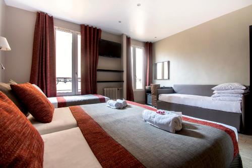 Habitación Cuádruple del hotel Migny Opera Montmartre. Foto 4