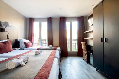 Habitación Cuádruple del hotel Migny Opera Montmartre. Foto 9