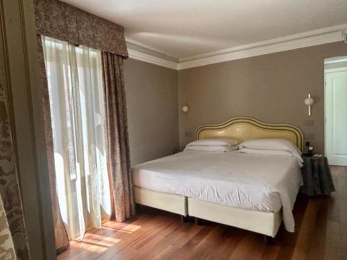 Habitación Doble Clásica con vistas al canal del hotel Cavalletto E Doge Orseolo. Foto 5