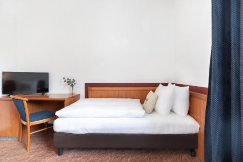 Habitación Triple Estándar del hotel Novum Aldea Berlin Centrum. Foto 2