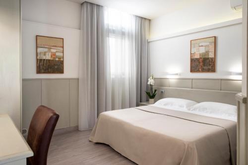 Habitación con 1 cama doble o 2 individuales - Anexo del hotel Grifone Firenze. Foto 6