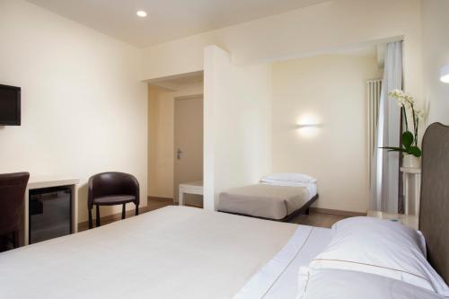 Habitación Triple Clásica - Anexo del hotel Grifone Firenze. Foto 1