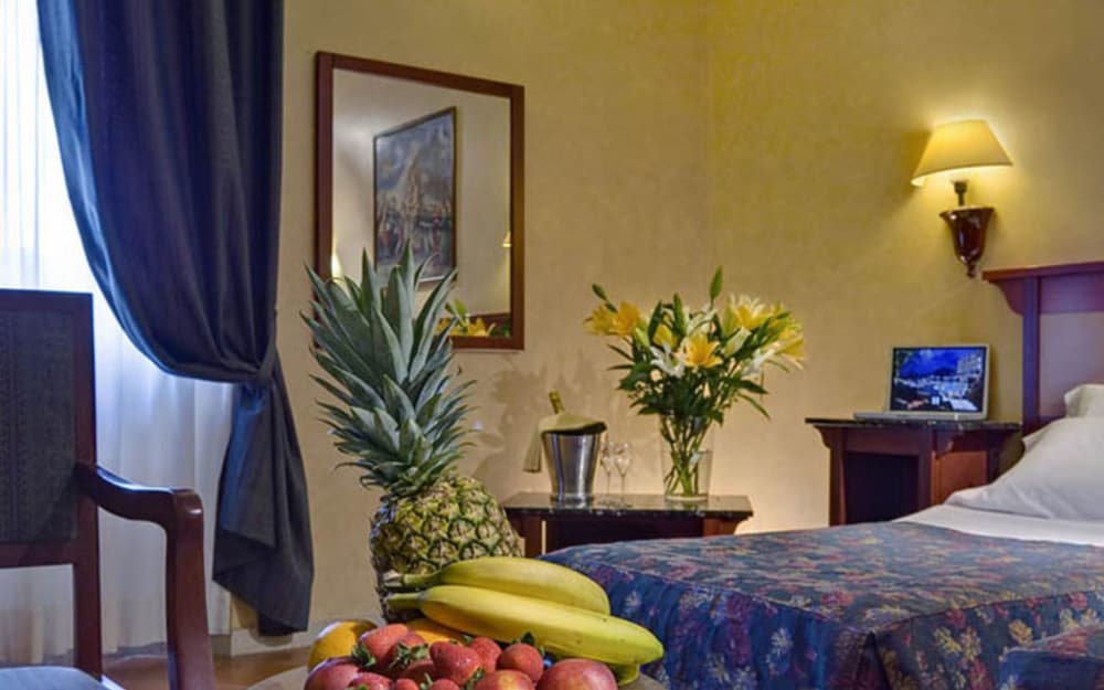 Habitación individual del hotel Corona D’italia