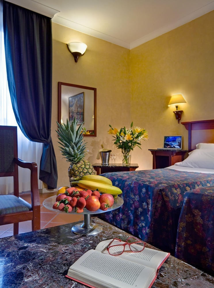 Habitación individual del hotel Corona D’italia. Foto 1