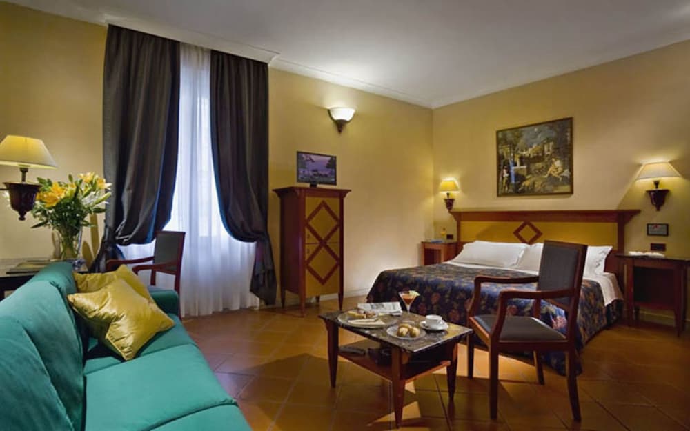 Habitación cuádruple del hotel Corona D’italia