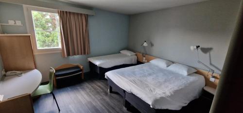 2 Habitaciones Dobles Contiguas del hotel Ibis Strasbourg Aéroport Le Zenith. Foto 2