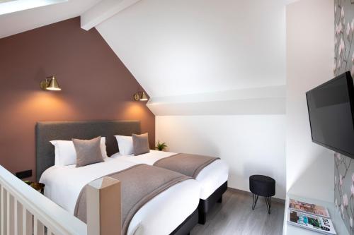 Habitación Triple del hotel Brady – Gare De L’est. Foto 1