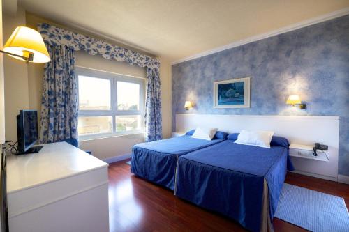 Habitación Triple del hotel Guadalquivir. Foto 2