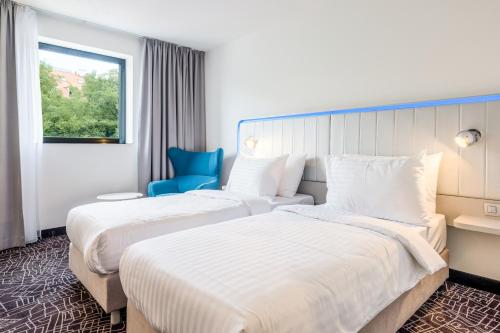 Habitación Superior con vistas al castillo del hotel Park Inn By Radisson Danube Bratislava. Foto 1