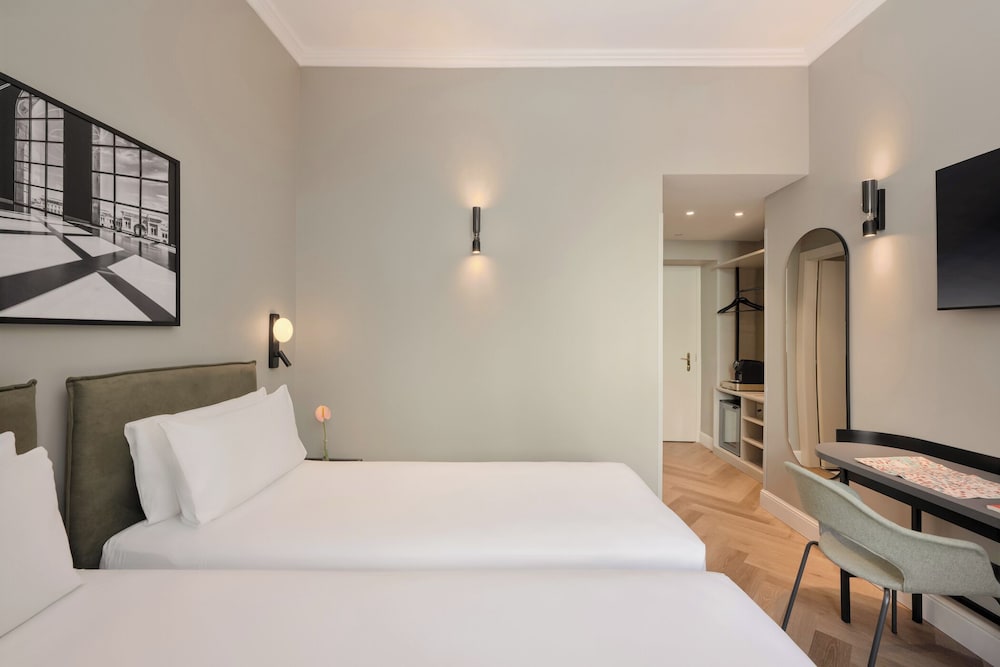 Habitación Deluxe con 2 camas individuales del hotel UNAHOTELS Galles Milano. Foto 3