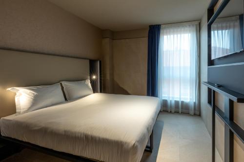 Habitación Triple con vistas a la ciudad del hotel Scarlatti Hotel Milano. Foto 1