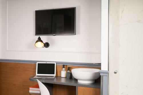 Habitación acogedora del hotel Petit Lafayette. Foto 3