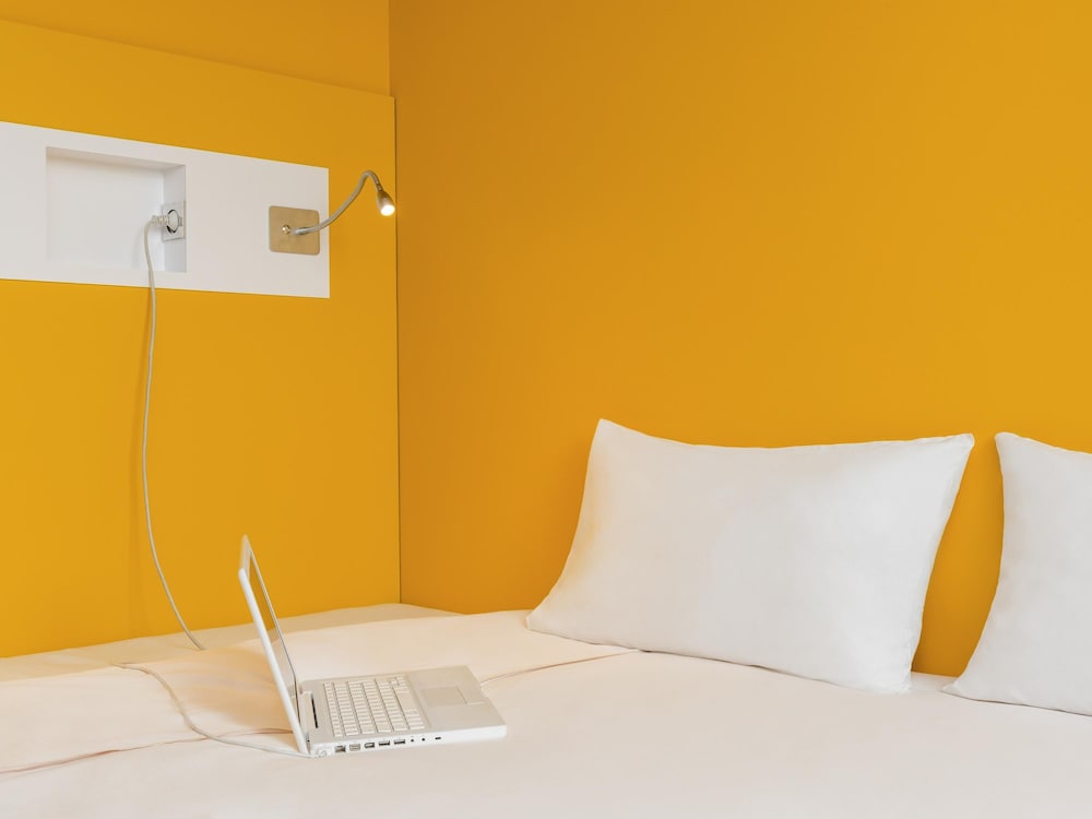 Habitación con camas individuales del hotel Ibis Budget Chateau Thierry