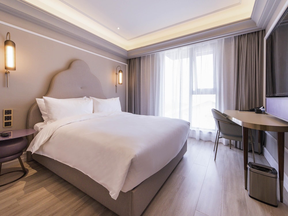 Habitación Deluxe, 1 cama de matrimonio grande del hotel Mercure Xi'an Downtown. Foto 1