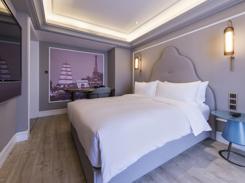 Habitación superior, 1 cama de matrimonio del hotel Mercure Xi'an Downtown. Foto 3