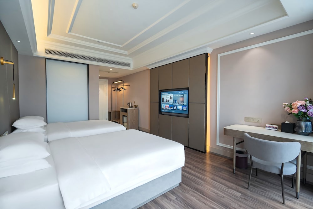 Habitación Deluxe con 2 camas individuales del hotel Mercure Hangzhou Liping. Foto 2