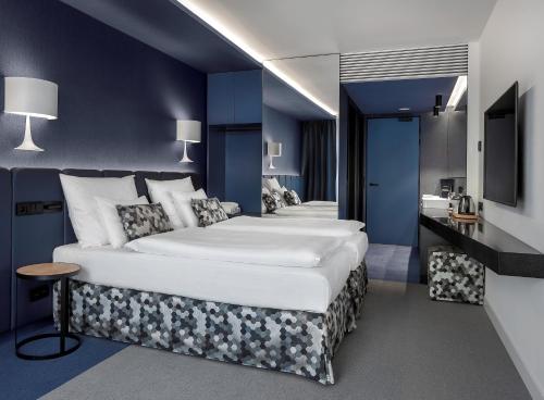 Habitación Cuádruple Deluxe del hotel Urban Creme