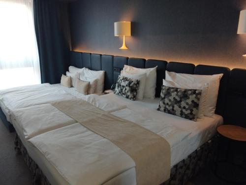 Habitación Cuádruple Deluxe del hotel Urban Creme. Foto 7
