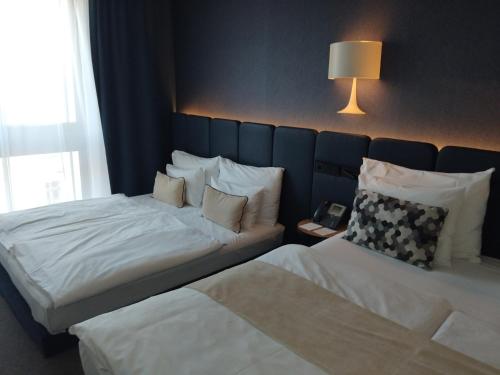Habitación Cuádruple Deluxe del hotel Urban Creme. Foto 8