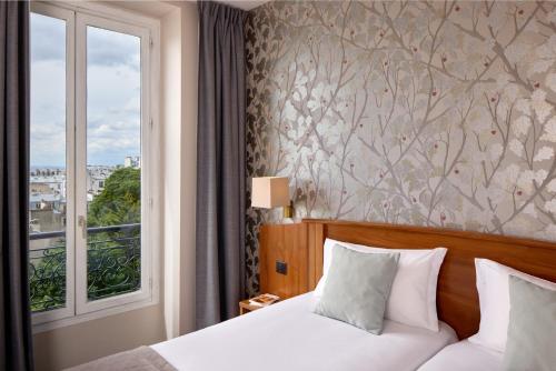 Habitación Doble Superior con vistas a París - 2 camas del hotel Timhotel Montmartre. Foto 3