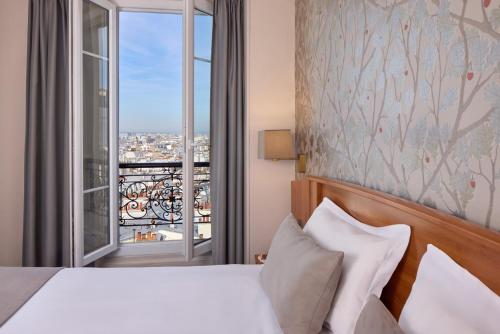 Habitación Doble Superior con vistas a París del hotel Timhotel Montmartre. Foto 3