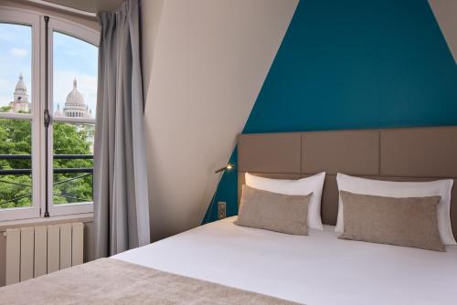 Suite con vistas a París del hotel Timhotel Montmartre. Foto 2