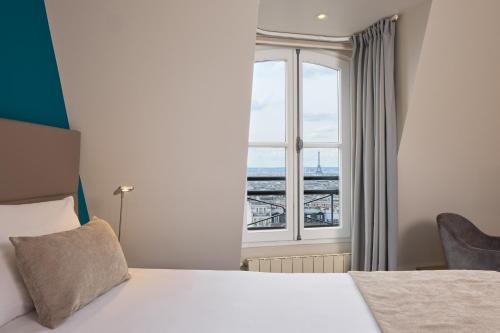 Suite con vistas a París del hotel Timhotel Montmartre. Foto 6