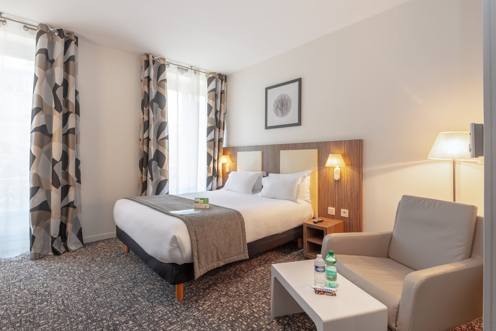 Suite, 1 cama de matrimonio (Living Area) del hotel Holiday Inn Paris Opéra Grands Boulevards, An Ihg. Foto 1