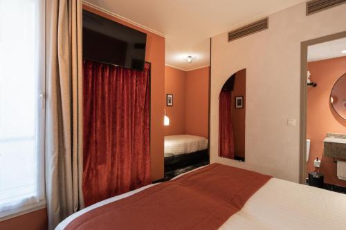 Habitación Triple Confort del hotel L'hôtel Royal Saint Germain. Foto 4