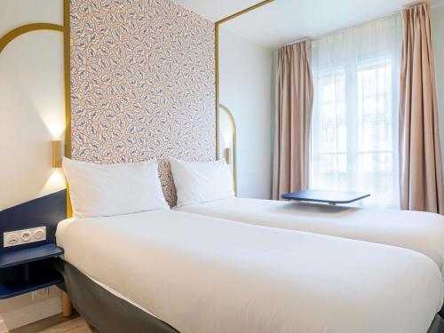 Habitación Doble Estándar - 2 camas del hotel Ibis Styles Paris Eiffel Cambronne. Foto 6