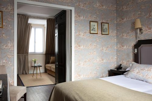 Habitación cuádruple del hotel Serotel Lutèce. Foto 1