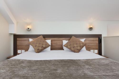 Suite Junior con cama grande del hotel Hotel Apolonia Paris Mouffetard, Sure Hotel Collection by BW. Foto 2