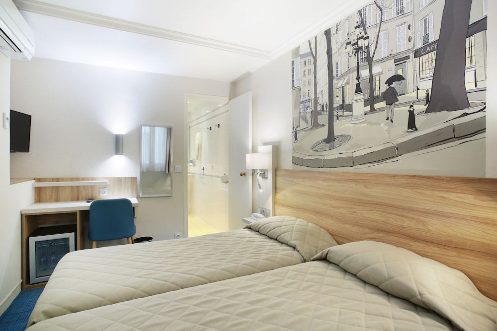 Habitación con 2 camas individuales del hotel Lautrec Opera. Foto 1