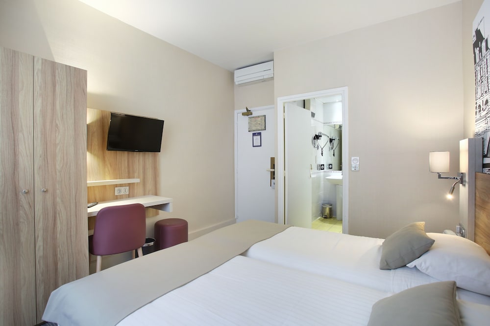 Habitación con 2 camas individuales del hotel Lautrec Opera. Foto 3