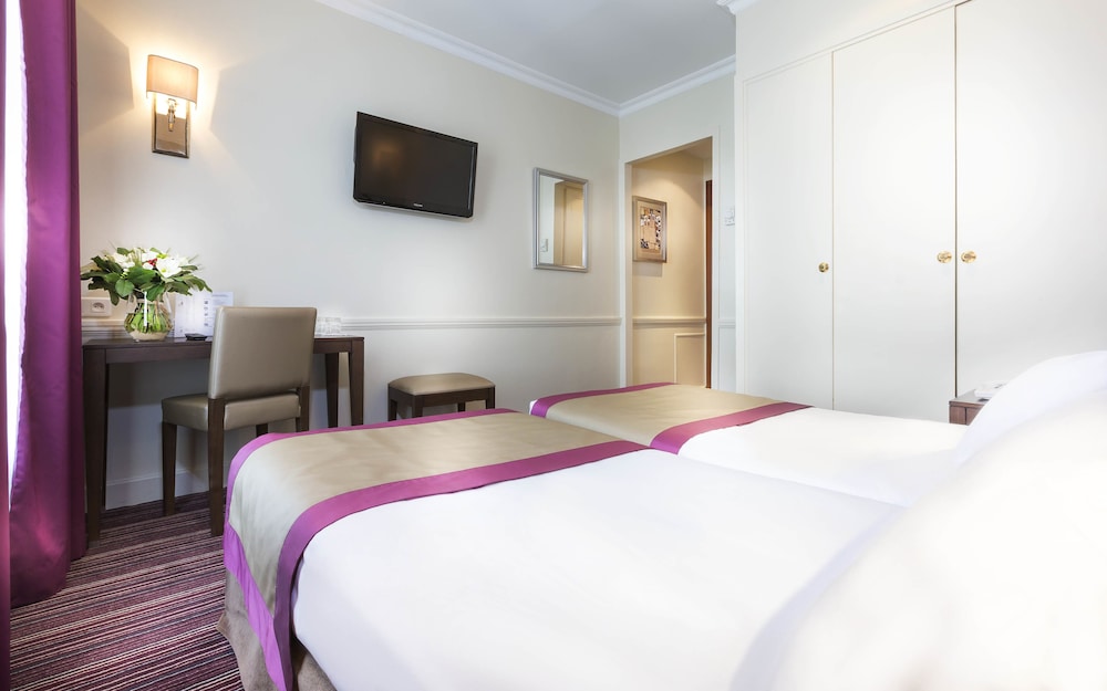 Habitación con 2 camas individuales del hotel Elysees Union. Foto 1