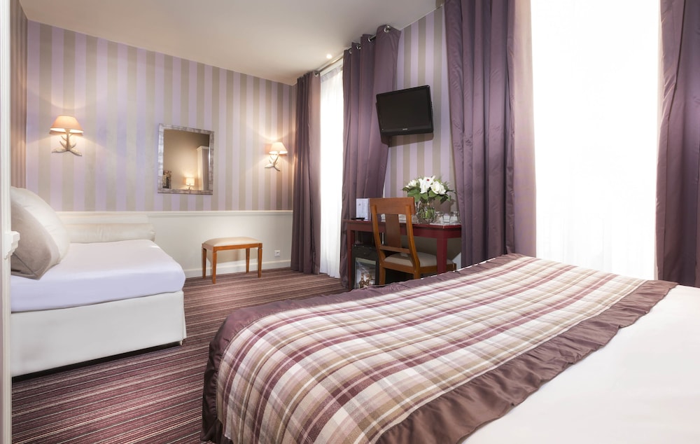 Habitación cuádruple del hotel Elysees Union. Foto 3