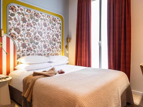 Habitación Doble Clásica del hotel Mercure Paris Notre Dame Saint Germain Des Prés. Foto 3