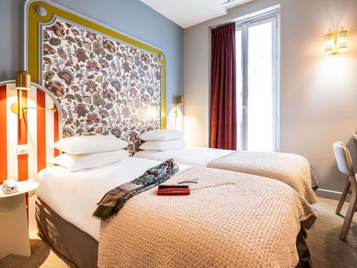 Habitación Doble Privilege - 2 camas del hotel Mercure Paris Notre Dame Saint Germain Des Prés. Foto 1