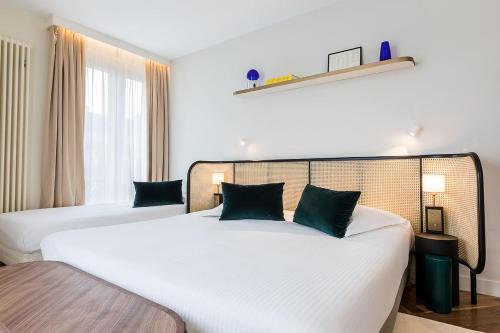 Habitación Triple Deluxe del hotel Le Friedland. Foto 14