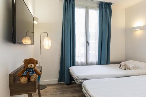 Suite Familiar del hotel Best Western Plus 61 Paris Nation. Foto 4
