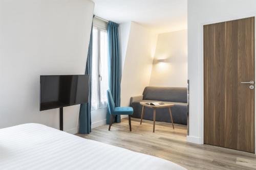 Suite Junior con sofá cama del hotel Best Western Plus 61 Paris Nation. Foto 7