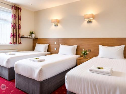 Habitación Triple del hotel Twickenham Guest House. Foto 2