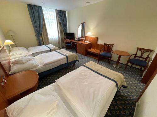 Habitación Triple del hotel Ramada By Wyndham Prague City Centre. Foto 3