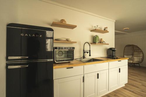 Suite de 1 dormitorio - Cama grande del hotel Woodlake Inn