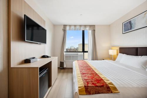 Habitación Deluxe con cama extragrande - No fumadores del hotel Ramada Flushing Queens. Foto 5