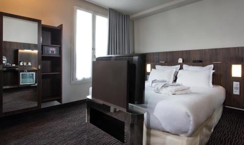 Habitación Doble Club del hotel Libertel Gare De L'est Francais. Foto 1