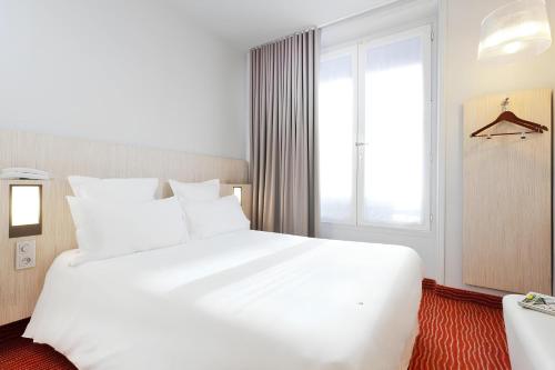 Habitación Doble Confort del hotel Libertel Gare De L'est Francais. Foto 8