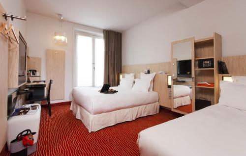 Habitación Familiar del hotel Libertel Gare De L'est Francais. Foto 2