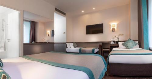 Habitación Triple del hotel Elysées Céramic. Foto 1